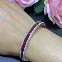 18K White Gold Diamond Bangle with 5.60ct bagget cut rubs %100 natural stones and 1.43ct in diamonds . RDB015NG2J Red ruby is the birthstone for the month of July;it exemplifies love, health and wisdom. It was believed that wearing a red ruby bestowed good fortune on its owner. A ruby is known to be the most valuable birthstone and its value increases based on its color and quality. Red Fine Jewelry Tennis Bracelet As Gift, Fine Jewelry Bangle With Brilliant Cut As Gift, Fine Jewelry Brilliant Cut Bangle As Gift, Red Oval Diamond Bracelet As Gift, Red Diamond Bracelet For Anniversary, Diamond Gemstone Bracelets As A Gift, Formal Ruby Bangle Jewelry, Red Tennis Bracelet For Wedding, White Gold Ruby Jewelry With Baguette Cut