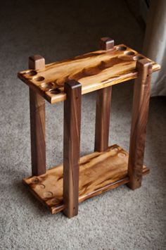 a wooden table sitting on top of a carpeted floor