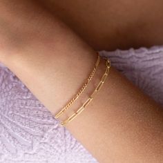 Our Piper Bracelet showcases a dotted detail paper clip chain making this an absolute classic! If you are local to Eau Claire stop by our storefront and add some charms for a personalized flare! DETAILSAvailable in 14k gold fill or sterling silver. Bracelet Sizing: XS= 5.5", S=6", M=6.5", L=7", XL=7.5".5" adjustable spring hook claspHypoallergenic and waterproof To measure your wrist size, wrap a piece of string around your wrist the way you would like the bracelet to fit. Then lay the string fl Dainty Gold Bracelet With Box Chain For Everyday, Adjustable Classic Charm Bracelet For Everyday, Adjustable Classic Charm Bracelet, Dainty Everyday Box Chain Bracelet, Classic Everyday Paperclip Bracelet With Delicate Chain, Classic Gold Jewelry For Friendship, Everyday Paperclip Chain Charm Bracelet, Classic Everyday Charm Bracelet With Adjustable Chain, Classic Everyday Chain Bracelet, Paperclip Style