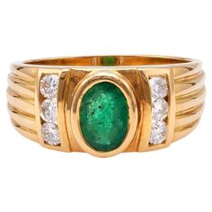 One Vintage French Emerald and Diamond 18k Yellow Gold Ring. Featuring one oval mixed cut emerald weighing approximately 0.65 carat. Accented by six round brilliant cut diamonds with a total weight of approximately 0.30 carat, graded G-H color, SI clarity. Crafted in 18 karat yellow gold with French hallmark. Circa 1980. The ring is a size 8 ¼ and may be resized. About this Item: Step into the playful glamour of the '80s with our emerald and diamond ring, a chic nod to the era of excess and bold style. The star of this show is a vibrant oval mixed cut emerald, approximately 0.65 carat, adding a pop of color that radiates vintage charm. Surrounding the emerald are six dazzling round brilliant cut diamonds, with a total weight of approximately 0.30 carat, creating a harmonious balance of spa 18k Yellow Gold Ring, Yellow Gold Ring, Emerald Diamond, Jewelry Rings Engagement, Round Brilliant Cut Diamond, Bold Fashion, Vintage French, Yellow Gold Rings, Vintage Charms