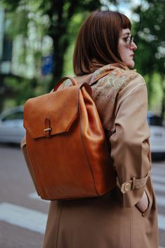 This handmade leather backpack is made with 100% natural full grain leather which is tanned with all natural materials. There is no chemical materials in this leather.  This backpack is handmade in our studio in Milan.  The backpack has one main compartment. There is One small zipped pocket in one side and one cellphone pocket in other side.  back side of the backpack has a outer pocket that has magnetic closure . All the bags will come with a cotton dust bag which can protect the leather and bag when it is not in use.  In options u can find Protection cream to add to your purchase. It will make the bag waterproof and will renew it after some use.  Dimensions :  Wide: 25.5 Cm / 10 inches Hight: 37.5 Cm / 14.7 inches  Deep: 11 Cm / 4.3 inches  it can hold up to 15' laptops Brown Leather Backpack With Smooth Grain, Brown Smooth Grain Standard Backpack, Everyday Backpack In Vegetable Tanned Leather, Everyday Vegetable Tanned Leather Backpack, Daily Use Vegetable Tanned Leather Backpack, Everyday Brown Vegetable Tanned Leather Backpack, Everyday Leather Backpack With Smooth Grain, Vegetable-tanned Leather Backpack For Travel, Brown Vegetable-tanned Leather Backpack For Daily Use