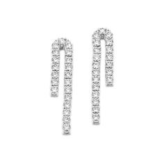 With their unique curved design and gorgeous natural diamonds  these tennis earrings will add the perfect touch of sparkle to any look. They’re crafted in bright 14-karat white gold with a secure yet comfortable friction back. Tennis Earrings, Natural Diamonds, Tennis, Dangle Earrings, Diamonds, White Gold, Sparkle, Gold, White