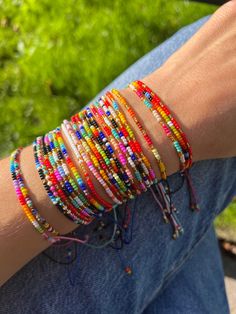 Beaded bracelets for women, handmade with love by indigenous communities in Colombia - they believe that wearing a piece is like carrying a part of the universe :) ❥ PICK YOUR SET OF 2 Pick your two favourite bracelets and select the corresponding numbers when placing your order. ❥ DIMENSIONS Bracelets are adjustable to every size with a sliding knot. Check out more ethnic bracelets in our shop: https://www.etsy.com/shop/IluminaCamino?ref=seller-platform-mcnav&section_id=25291255 ❉ ❉ ❉ ❉ ❉ ❉ WOR Colorful Adjustable Round Bead Jewelry, Spiritual Rainbow Beaded Friendship Bracelets, Colorful Adjustable Round Bead Bracelets, Colorful Adjustable Bracelets With Round Beads, Multicolor Tiny Beads Braided Bracelets For Friendship, Multicolor Braided Bracelets With Tiny Beads For Friendship, Trendy Beaded Rainbow Friendship Bracelets, Adjustable Colorful Hand-strung Bracelets, Colorful Adjustable Hand-strung Beaded Bracelets