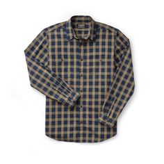 Ideal for work and everyday wear, our Wildwood Shirt is made of a breathable, pre-washed cotton twill for comfort and durability. A pleated back provides a full range of motion through the shoulders. Button front with button-adjustable cuffs for a custom fit. Two chest pockets hold pencils, tools, phones or other accessories. | Filson Wildwood Shirt Bronze/Navy Plaid Size XS Classic Cotton Shirt For Outdoor, Classic Relaxed Fit Shirt For Outdoor, Casual Long Sleeve Shirt For Outdoor Work, Rugged Cotton Shirt For Fall, Rugged Cotton Everyday Tops, Rugged Long Sleeve Cotton Flannel Shirt, Rugged Cotton Shirt, Outdoor Cotton Button-up Flannel Shirt, Unstructured Rugged Cotton Tops