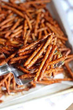 there is a fork full of cheetos on the plate