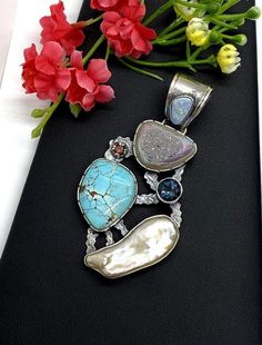 "Artisan Turquoise gemstone Pendant Hand-made Sterling Silver 925. Stones used: Rainbow Druzy, Turquoise, Australian Opal, Pearl, London Blue Topaz, Garnet Height - 3\" (with bail), Width - 1 5/8\" Height -75mm (with bail), Width - 40mm Unique Handcrafted One-of a-kind Design Each Piece of Jewelry in my Collection is Absolutely One of a Kind! When you start wearing a piece of my jewelry you will fall in love with it more and more each day and feel that good Energy and Love that I pass into it wh Turquoise Gemstone Fusion Jewelry, Fusion Turquoise Gemstone Jewelry, Fusion Style Turquoise Gemstone Jewelry, Elegant Multi-stone Turquoise Gemstones, Turquoise Natural Stones Pendant Gemstones, Turquoise Pendant Gemstone, Turquoise Natural Stone Pendant, Turquoise Multi-stone Round Gemstones, Turquoise Multi-stone Gemstones