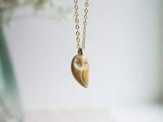 This handmade ceramic necklace is made of stoneware clay, hand shaped without any mold. Necklace is light and comfortable to wear. Glazed on both sides. The chain is 18K gold plated 925 silver. It will arrive gift wrapped, ready to give as a gift or keep for yourself. Due to its handmade nature it is a unique piece. Each item is made one by one at hand with much love and care. The making of ceramic has too many stages. First clay gets its form, the object is let to dry a few days, then imperfect Gold Polymer Clay Pendant Necklace, Gold Pendant Necklace In Polymer Clay, Unique Gold Polymer Clay Necklace, Unique Clay Necklace For Gifts, Unique Clay Necklaces For Gifts, Unique Clay Necklace For Gift, Unique Everyday Clay Jewelry, Gold Polymer Clay Jewelry For Everyday, Handmade Yellow Necklaces For Everyday