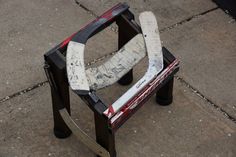 a broken chair sitting on top of a sidewalk