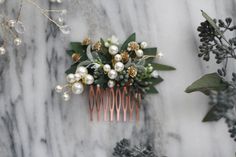 "This REAL  eucalyptus hair comb, wedding hair accessory, bridal floral comb, boho festival floral hair vine features REAL NATURAL and preserved seeded eucalyptus and sprays of vegan pearls and faux gold tone babys breath. All the components are securely attached onto a mini rosegold plated comb. This comb is perfect for a boho or woodland wedding. You can wear it tucked into a low relaxed bun or a french braid. The actual floral part measures approx 3 inches long by 1.5 inches tall.  The full head piece measures approx. 3 inches by 3 inches. If you want a metal base comb, please make your selection at the moment of ordering **PLEASE READ: CANADIAN SHOPPERS - Please note that due to Etsy's updated tax system, the sales taxes (GST, HST and QST) for the item + shipping must be included in th Bridal Floral Hair, Flower Garland Hair, Floral Hair Piece, Floral Headpiece Wedding, Floral Hair Vine, Pearl Comb, Pink Flower Headband, Flower Crown Bride, Bridal Floral Crown