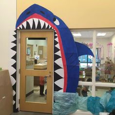 a door with a giant shark head on it