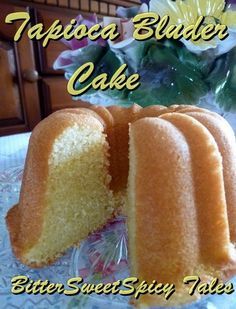 a close up of a bundt cake on a plate with flowers in the background