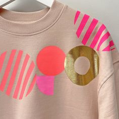 Geometric Pattern Statement hand screen-printed Women's quality sweatshirt.  *Please note I print to order so allow 5 days for the order to be processed* Made from 100% combed organic cotton,Earth positive, fair-trade garment.  Brushed 3-ply 9.44 oz / 320 g The Sweatshirt colour is 'Misty Pink' which is a soft pale pink   Screenprinted by myself in Brighton using water based inks. Gold foil on detail AVAILABLE IN SIZES:  SMALL, MEDIUM, LARGE and XL *PLEASE REFER TO SIZE CHART IN PHOTOS FOR MEASU Cool Sweatshirts For Women, Sweatshirt Print, Jeweled Shoes, Unique Sweatshirt, Womens Sweatshirts, Neon Coral, Old Clothes, Hand Screen Printed, Print Sweatshirt