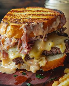 a grilled cheese sandwich with meat and melted cheese