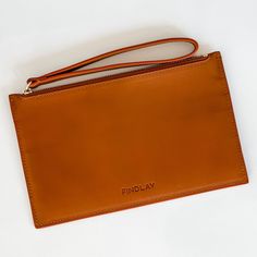 Chic and minimalist, the Slim Zip Wallet fits all the essentials for your "on the go" lifestyle. Crafted in smooth, buttery soft and sweet smelling leather. This wallet works great tossed inside a Findlay Tote or Crossbody, but also great to carry on its own for a night out on the town. Interior includes 1 large cash pocket and 4 card pockets that can fit 1-2 cards each. Also fits most mobile phones. - Smooth Full Grain 100% traceable Italian Vegetable-Tanned leather - Color - Bourbon Brown - 1 Rfid Blocking Clutch Wallets For Everyday Use, Classic Everyday Coin Purse With Smooth Grain, Everyday Soft Leather Clutch Wallet, Versatile Everyday Clutch With Smooth Grain, Minimalist Wallets With Zipper Pouch For Daily Use, Minimalist Wallet With Zipper Pouch For Daily Use, Minimalist Travel Wallet With Zipper Pouch, Everyday Clutch Wallet With Smooth Grain, Daily Use Clutch Wallets With Smooth Grain