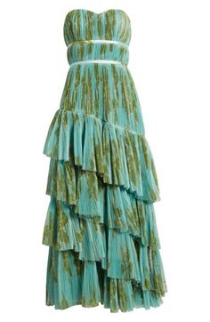 a green dress with tiered layers on it