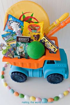 a toy truck filled with candy and snacks