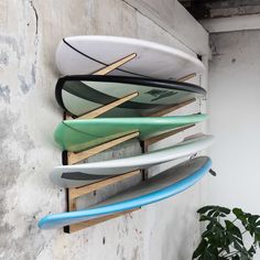 several surfboards are hanging on the wall