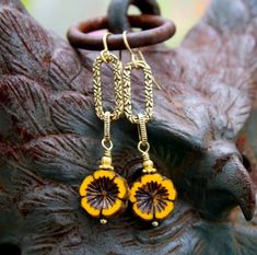 Rustic Gold Sunflower Earring Dangles Warm Yellow Czech Glass | Etsy Rustic Gold Brass Jewelry, Vintage Gold Jewelry With Sunflower Design, Rustic Gold Dangle Jewelry, Gold Sunflower Dangle Jewelry, Yellow Brass Dangle Jewelry, Rustic Beaded Gold Jewelry, Rustic Gold Beaded Jewelry, Rustic Gold Jewelry For Gifts, Yellow Bohemian Jewelry With Sunflower Design