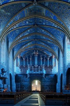 the inside of an old church with pews