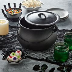 a table topped with lots of halloween food