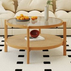 a living room with white couches and a coffee table in front of the couch