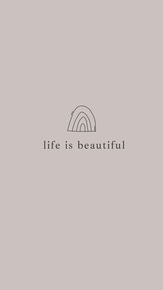 the words life is beautiful are in black and white on a gray background with an image of