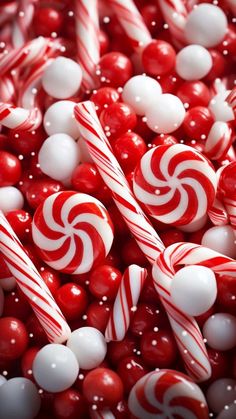 red and white candy canes are in a pile