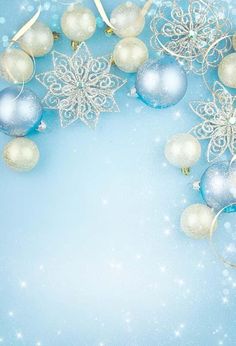 a blue and white christmas background with ornaments