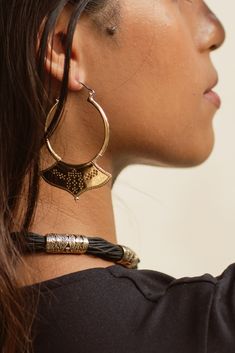 The Ashia Hoops are a must have for the lovers of statement hoops. Inspired Afghani shaped hoops with a unique dot geometric engraving , the Ashia gives an edgy feel to These Tribal inspired Hoop earrings . DETAILS: * Sold as pair * Made from High quality Italian brass with surgical stainless steel ear hook .* Width of widest part of the hoop - 4.2 cm * Length from top of earring to bottom - 7.3 cm * Weight - 21 grams Jewelry Care :✼ Jewelry will oxidised over time with everyday wear and exposure. Use a polishing cloth to restore shine . Avoid water and lotions .store in a safe , clean and dry location. Luxury Bohemian Black Jewelry, Necklace Hoops, 21 Grams, Bangle Ring, Ethnic Looks, Ear Hook, Cotton Rope, Earring Necklace, Jewelry Care