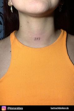 a woman with a small tattoo on her neck and the number 717 written in it