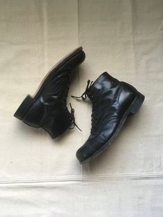 "1920s men's ankle boots work wear black leather leather sole steel toe cap toe 10 eyelet- top 4 hook Good Year Wing Foot heel cap brown leather lined felt lined tongue steel arch good vintage condition, light wear light marks, fade, scuffs, nicks-esp. toes (see photos) marked size 8, see below measures, insole-10 3/4\" sole-11 3/4\" width-4 1/4\" heel-1 1/2\" total height-6\"" Vintage Boots With Reinforced Cap Toe, Vintage Lace-up Goodyear Welted Work Boots, Vintage Closed Toe Boots With Rubber Heel Cap, Vintage Goodyear Welted Lace-up Work Boots, Vintage Lace-up Work Boots With Goodyear Welted, Vintage Lace-up Work Boots With Goodyear Welt, Vintage Lace-up Boots With Goodyear Welt Construction, Vintage Winter Ankle Work Boots, Vintage Leather Combat Boots With Plain Toe