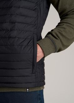 About Our Tall Men's Packable Puffer Vest Bring essential warmth on the go with our tall men's packable puffer vest. Designed specifically for guys from 6’3 to 7’1, this vest is long enough for your torso without being baggy. It’s been tailored with a modern fit that can be worn over any long sleeve polos or tees. The full zip makes it easy to customize your personal climate while the tall collar helps to block cool breezes. Insulated with lightweight poly fill, this vest jacket for tall men add Sleeveless Black Down Outerwear, Black Quilted Nylon Vest, Quilted Black Nylon Vest, Black Vest For Hiking In Fall, Black Quilted Outdoor Vest, Black Casual Puffer Jacket For Travel, Casual Black Puffer Jacket For Travel, Black Hiking Vest Outerwear, Black Winter Hiking Vest