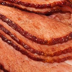 sliced bacon sitting on top of a cutting board