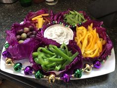 a platter filled with different types of vegetables