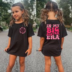 -In My Big Sister Era Shirt, Cute Big Sister Shirt, Funny Toddler T-shirt, Cute Retro Big Sis Kids Shirt, Big Sis Tee, Two Side Sister Shirt Welcome to LittleLambsLounge! -Our products come in 3 types: onesie® bodysuit, toddler, and youth size shirt. -The monthly sizes you choose will come as bodysuit® onesie®, available in both long sleeve and short sleeve options. We take pride in offering a delightful range of clothing for your little ones, crafted from super-soft fabrics that both you and your baby will adore. Our commitment is evident in every thread, as each piece is sustainably handmade-to-order, accompanied by a certificate of authenticity. FEATURES: We prioritize your kids' comfort! Our garments are made from ethically sourced ultra-soft fabrics and printed with safe, eco-friendly Cute Black Short Sleeve Shirt, Cute Short Sleeve Tops With Name Print, Cute Short Sleeve Shirt With Slogan, Cute Black Tops For School, Cute Short Sleeve Shirt With Name Print, Cute Short Sleeve Shirt With Funny Text, Short Sleeve Graphic Print Tops For School, Graphic Print Short Sleeve Tops For School, Cute Short Sleeve Shirt With Text Print