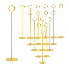 a group of gold poles with circles on them