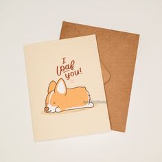 a card with an image of a corgi laying down on it's side