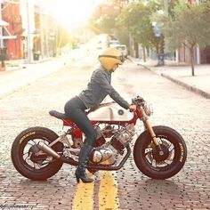 a person sitting on top of a motorcycle