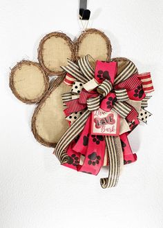 a dog's paw shaped decoration hangs on the wall