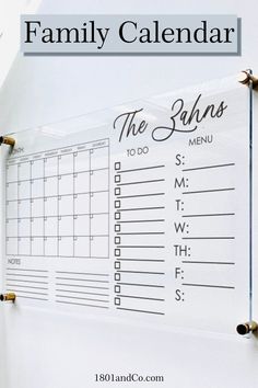 a family calendar hanging on the wall