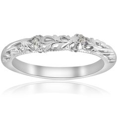 a white gold wedding ring with leaves and diamonds