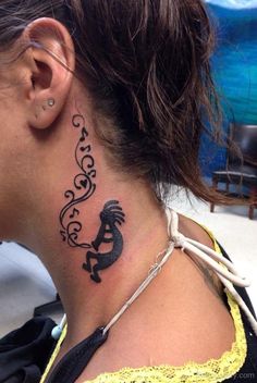 a woman with a tattoo on her neck