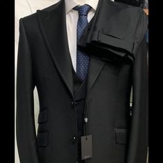 Black Super 150 Cerruti Neapolitan 3 Piece Wool Suit. Double Breasted Vest Ticket Pocket, Double Vent, Wide 5 Inch Peak Lapel, Double Stitched. Flat Front Pant. Available Ready To Wear Or Custom Made In Any Size. If The Price, Cut, Fit And Quality Of This Suit Does Not Exceed Your Expectations, Return It For Full Refund. Made In Italy By La Based Suit Maker. Winstonandlee. Shipped To You In 7 Days. Distributors Needed In East Coast Due To Demand. Elegant Black Three-piece Suit For Workwear, Elegant Black Three-piece Suit For Work, Luxury Tailored Black Suit, Tailored Black Three-piece Suit For Office, Elegant Black Three-piece Suit With Notch Lapel, Luxury Fitted Black Blazer, Luxury Fitted Three-piece Suit For Office, Luxury Fitted Black Three-piece Suit, Classic Tailored Black Three-piece Suit