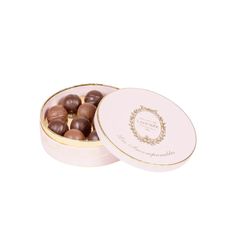 a white box filled with chocolates on top of a table