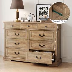 a dresser with drawers and a lamp next to it