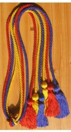 multicolored rope with tassels on wooden floor