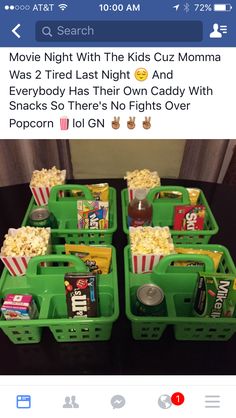 four green baskets filled with movie snacks and sodas on top of a black table