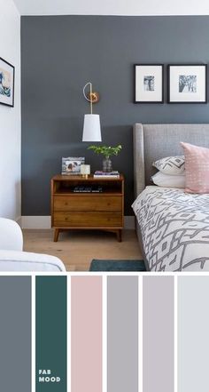 a bedroom with gray walls and pink accents