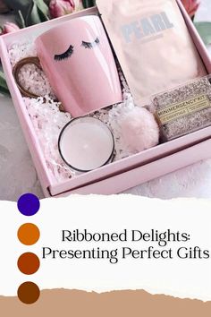 a pink gift box with two mugs and some other items in it that are labeled ribboned delights presenting perfect gifts