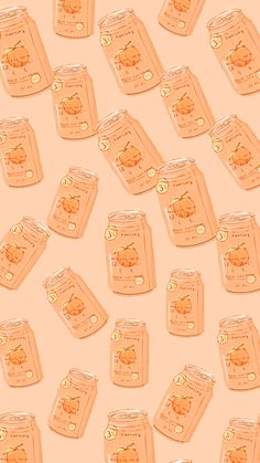 many jars with peaches in them on a pink background